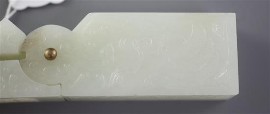 A Chinese archaistic pale celadon jade vessel or instrument, 9.5cm